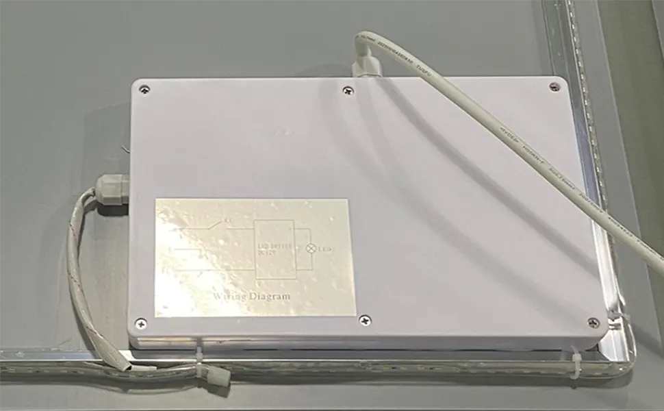 Back of LED mirror showing LED light strips and driver for efficient illumination.